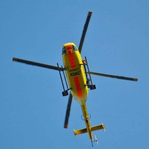 Search & Rescue helicopter hovering overhead