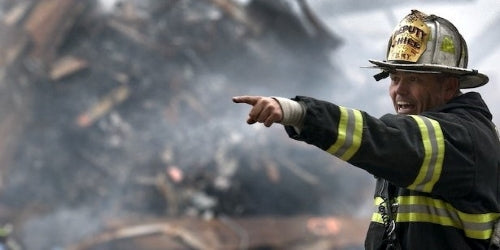Catastrophic widespread natural disaster. Fire Chief Incident Commander, directing firefighters and, volunteer help, in collapsed building rescue.
