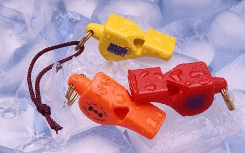 hi-tech emergency safety whistles pictured with prominent safety organizations logos embossed on them. 